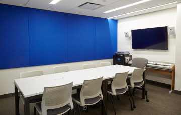 Allen library small seminar room, with TV display, keyboard, and tables